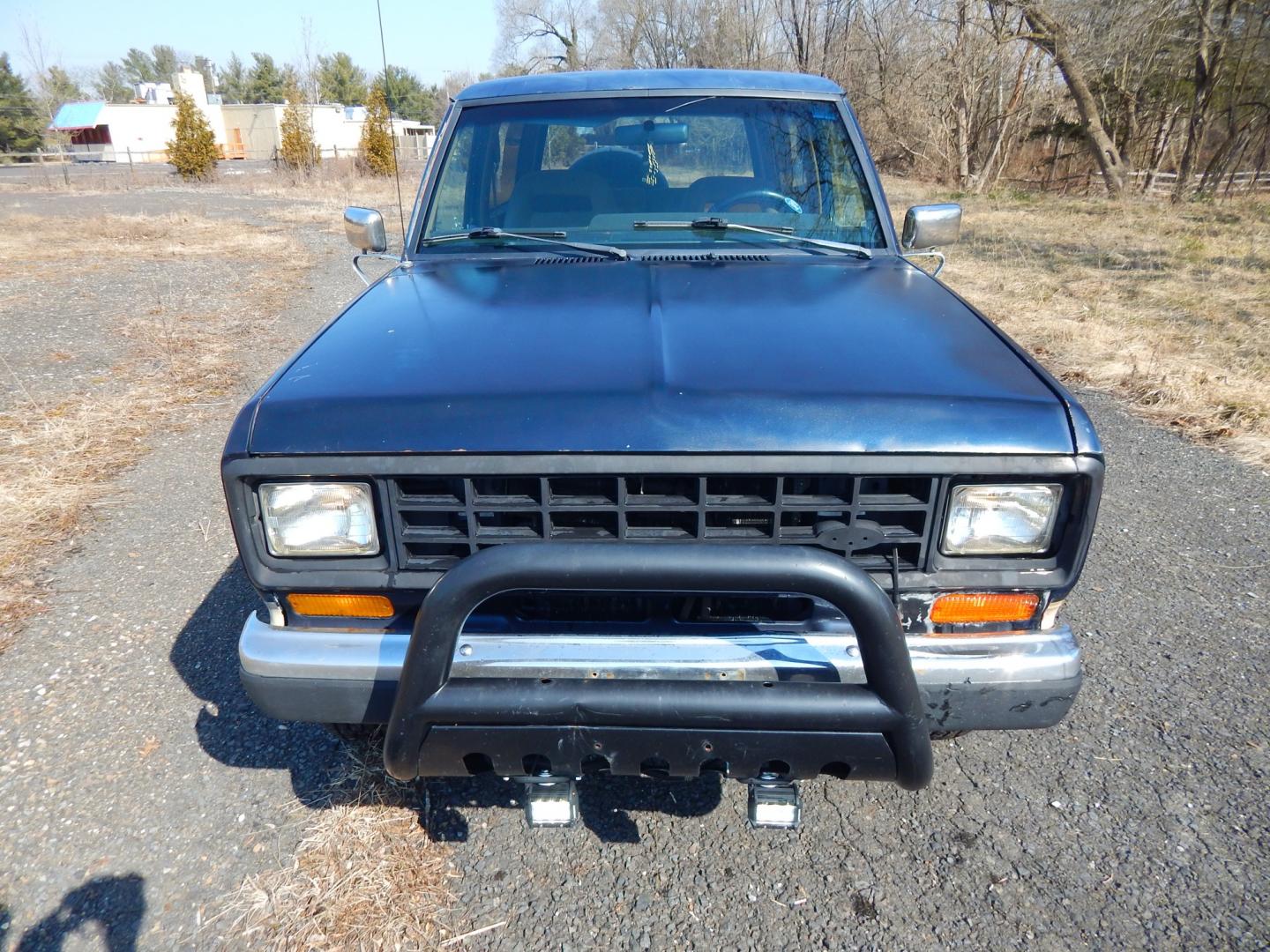 1988 Blue /Tan Ford Bronco II 4WD (1FMCU14T6JU) with an 2.9L V6 OHV 12V engine, 4-Speed Automatic Overdrive transmission, located at 6528 Lower York Road, New Hope, PA, 18938, (215) 862-9555, 40.358707, -74.977882 - Here we have a 1988 Ford Bronco 2 with a 2.9L V6 putting power to a 4x4 automatic transmission. Options include: tan cloth interior, heat/AC, XD Vision radio, power windows, cruise control, tilt steering wheel, front/rear defrost windows, spare tire cover, 15 inch alloy wheels with 4 Solarus AP tire - Photo#20